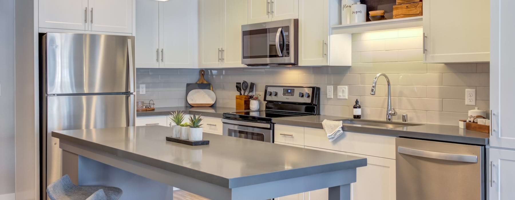a kitchen with white cabinets