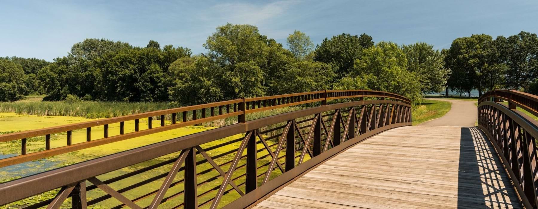 a wooden bridge over a river