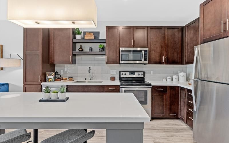 a kitchen with wooden cabinets
