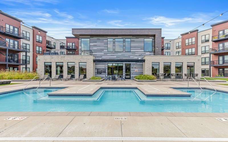 a swimming pool in front of a building