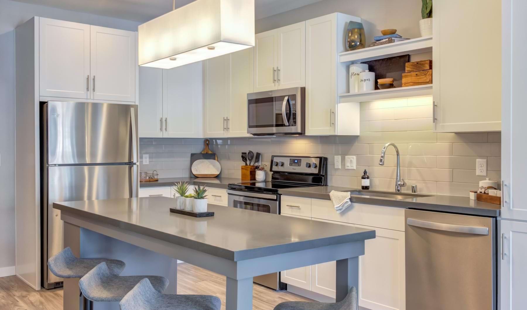a kitchen with white cabinets